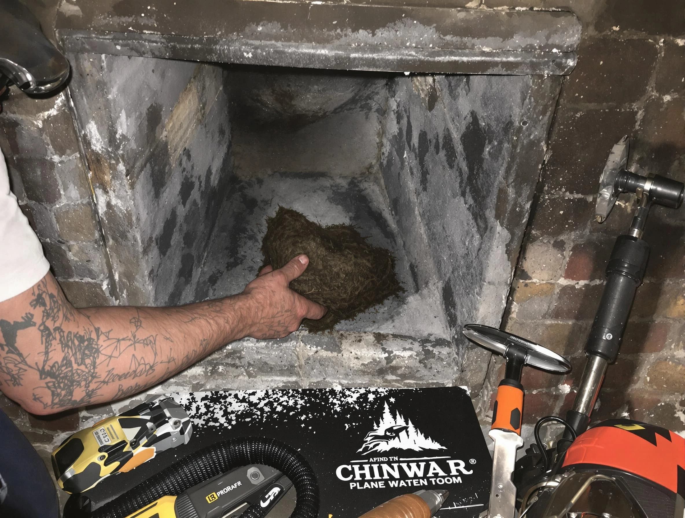 Hooper Chimney Sweep safely removing debris and screening chimney in Hooper, UT
