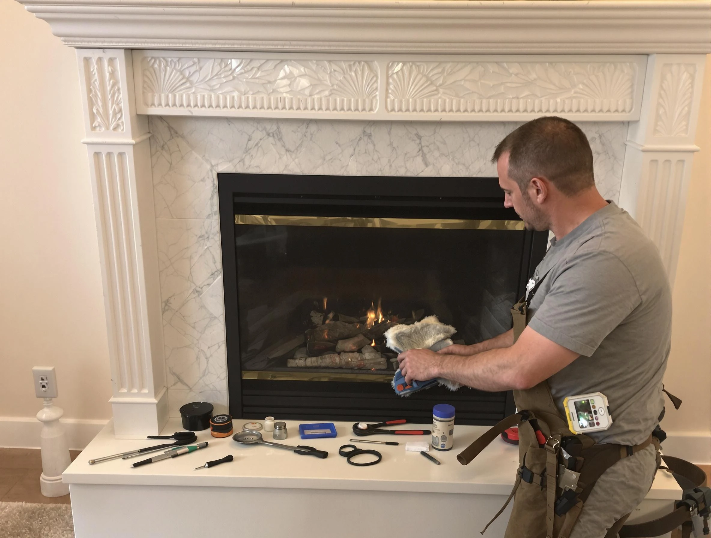 Hooper Chimney Sweep performing fireplace maintenance in Hooper, UT